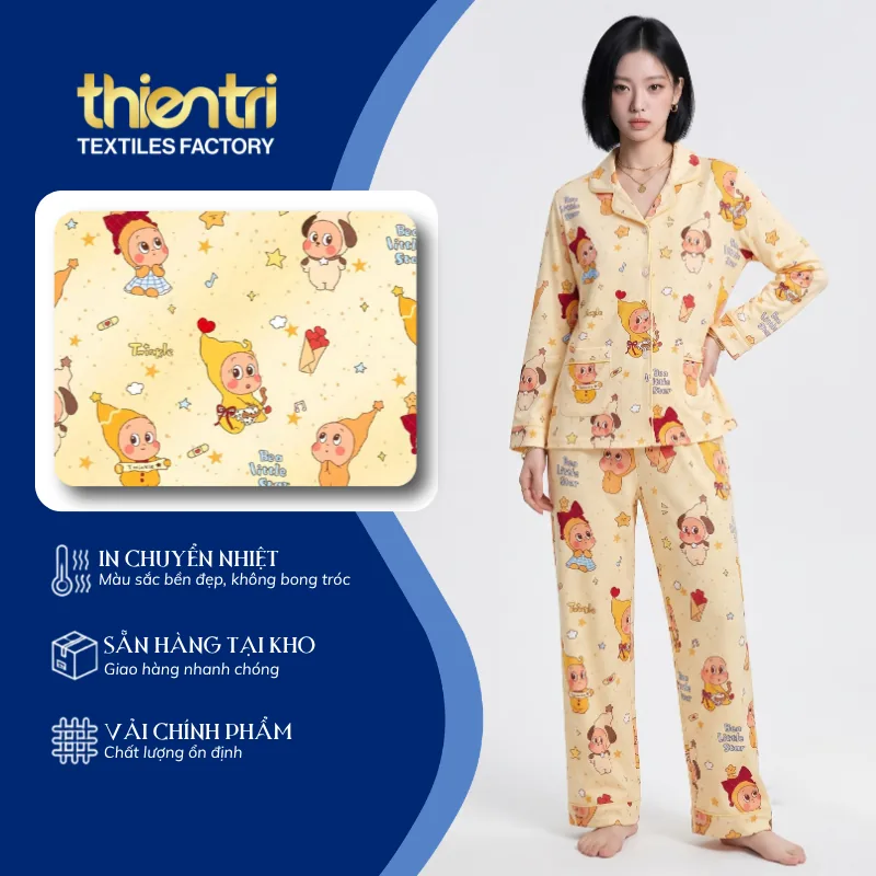 Bộ pijama may từ vải in họa tiết hoạt hình trên nền kem
